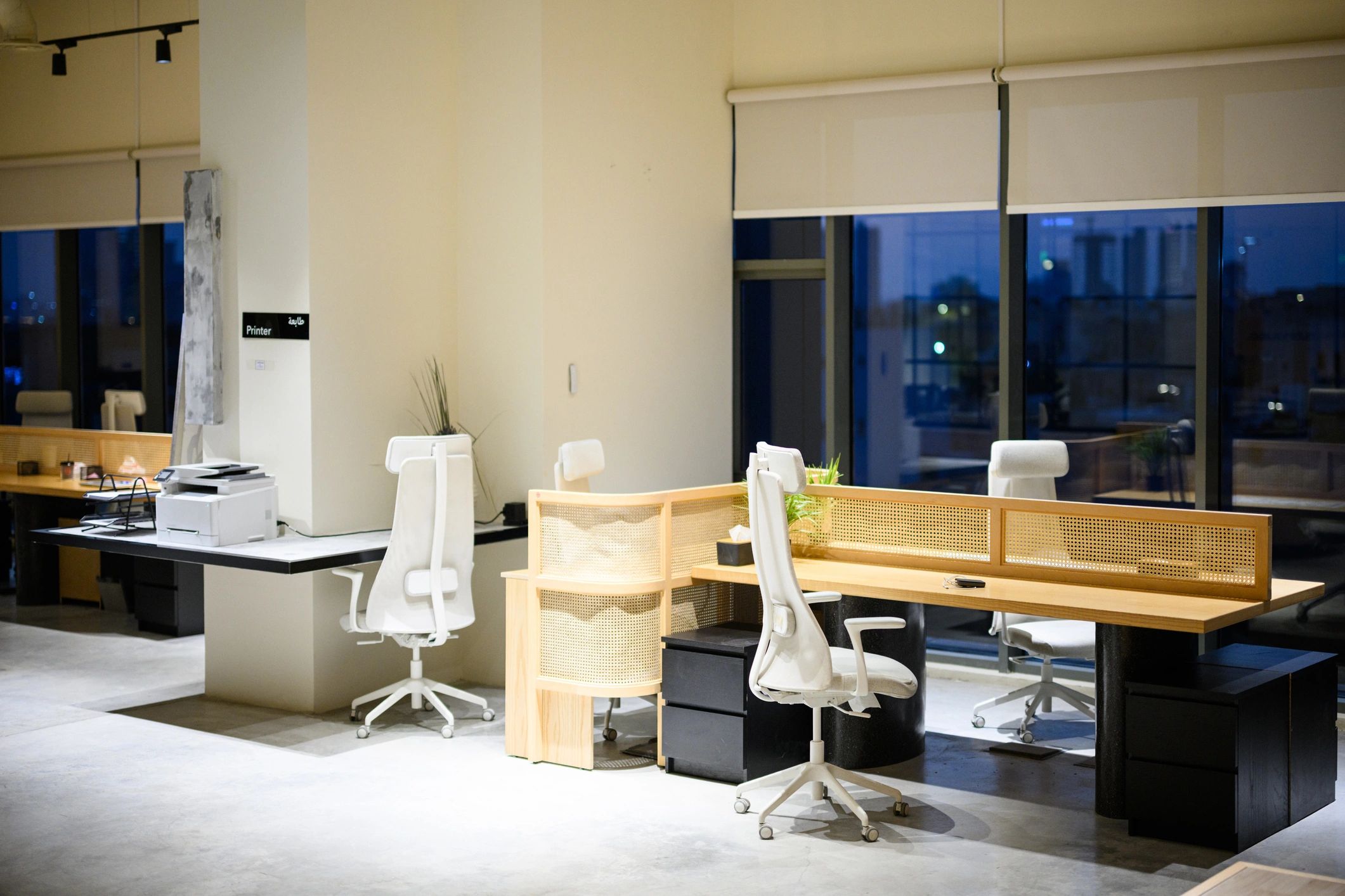 Modern corporate office interior with desks and city view